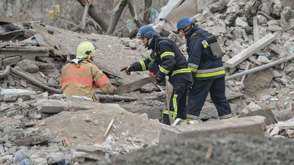 Rescuers at the site of a Russian missile strike on an apartment building in Vilnyansk last week