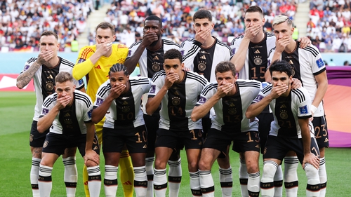 The Germany team covered their mouths before their game with Japan to protest FIFA threatening to punish players who wore the OneLove armband