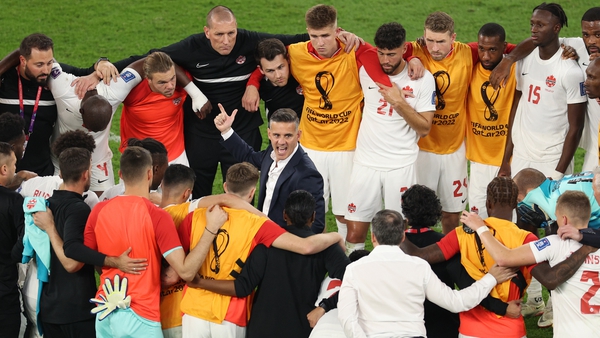 John Herdman addresses his players after the game