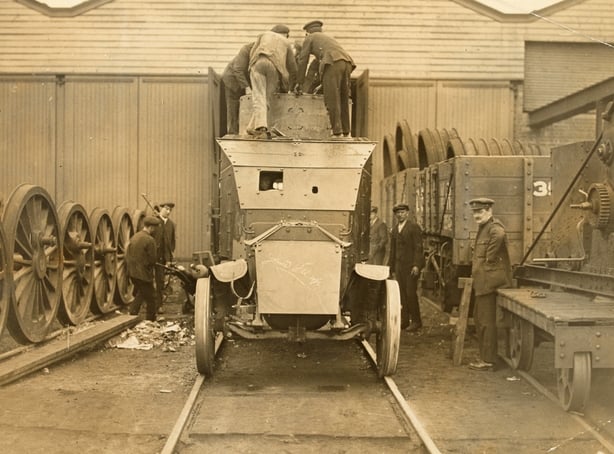 Information from users of NLI Flickr Commons: Members of the Railway Protection Repair and Maintenance Corps at Inchicore Works, Dublin, converting Lancia Armoured Cars for use on railways. This work was carried on between 1921 and 1923. Over 50 original open top Lancia Armoured Cars were converted at Inchicore, but only 7 were converted to rail cars. The road or highway version of the Lancias converted at Inchicore were used by the Irish army until WWII, and were known as the ''Hooded Terrors''. No Lancia rail cars survive, although one was kept in a siding at Inchicore until the 1950s.