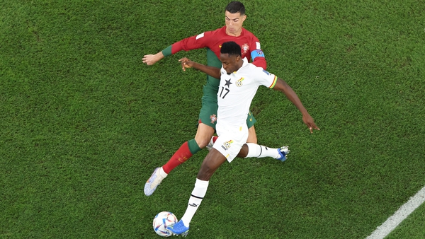 Cristiano Ronaldo of Portugal battles for possession with Abdul Rahman Baba of Ghana