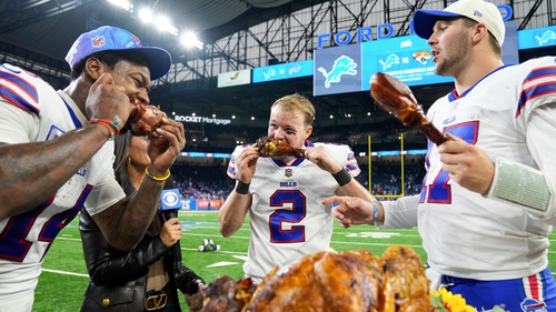 Stefon Diggs and Tyler Bass tear into turkey legs while Buffalo Bills quarterback Josh Allen discusses his side's victory with CBS