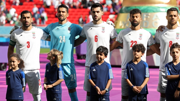 (L-R) Ehsan Hajsafi, Hossein Hosseini, Saeid Ezatolahi, Amir Abedzadeh and Morteza Pouraliganji sing the national anthem ahead of the Qatar 2022 World Cup Group B match against Wales