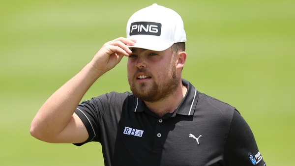 Dan Bradbury acknowledges the crowd on the 18th green