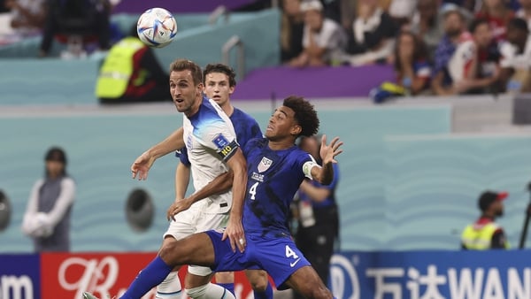Tyler Adams of United States vies with Harry Kane