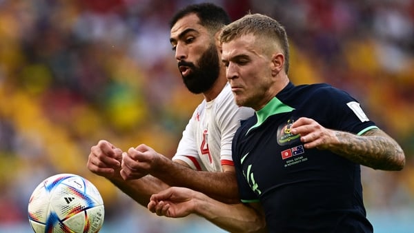 Tunisia's Yassine Meriah and Australia's midfielder Riley McGree fight for the ball