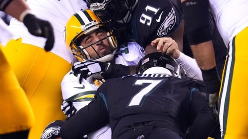 Aaron Rodgers of the Green Bay Packers is sacked by Brandon Graham of the Philadelphia Eagles