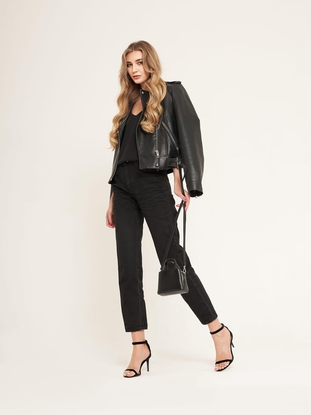 Woman wearing black jeans outfit