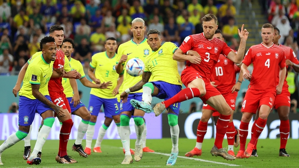 Brazil's Raphinha tries to control the ball under heavy pressure
