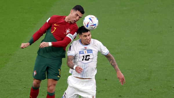 Cristiano Ronaldo rises with Mathias Olivera