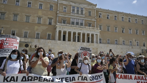 Health workers protest in front of the Greek parliament against mandatory vaccines in September 2021