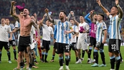 Leo Messi (C) celebrates with team-mates and fans