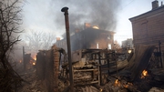 A building burns after shelling in Bakhmut in the Donetsk region