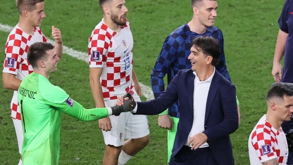Dominik Livakovic is congratulated by Zlatko Dalic after his pivotal role in Croatia's success over Japan