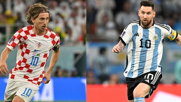 Luka Modric (L) and Lionel Messi