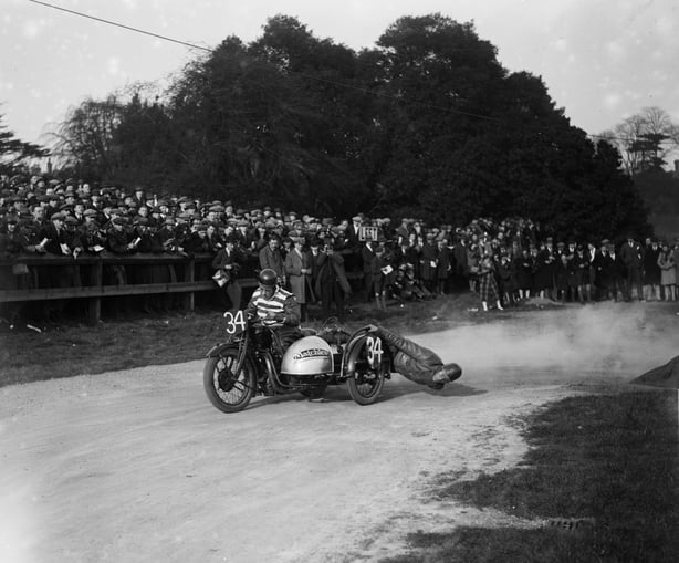 17th March 1928:  FH Blackpool and partner take the Maize hair-pin bend at speed during a motorcycle race on the TT course at Crystal Palace, London.  (Photo by Walter Bellamy/London Express/Getty Images)