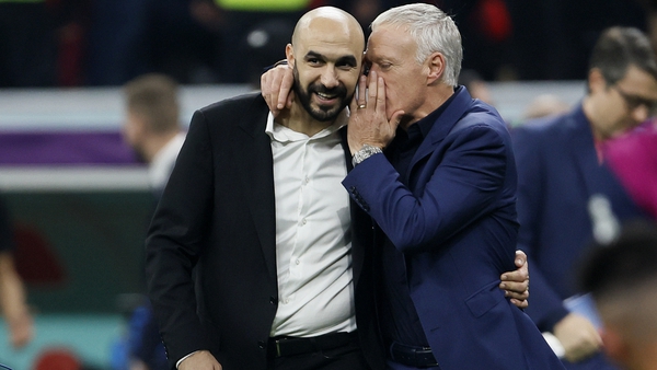 A word in the ear of Walid Regragui from France head coach Didier Deschamps following the game