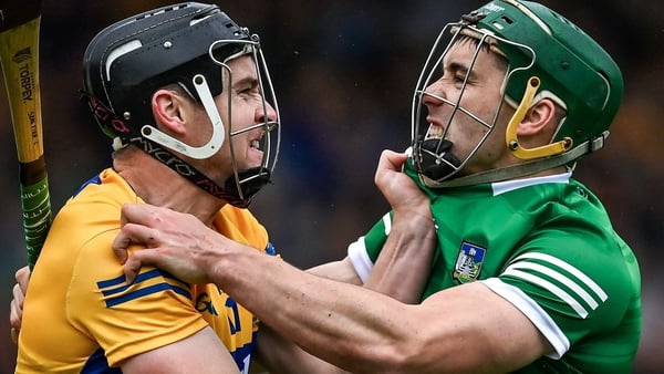 Clare's Tony Kelly (L) and Limerick's Sean Finn get to grips during last season's Munster final