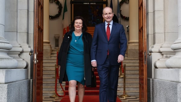 Micheál Martin, with Mary Martin, leaves Government Buildings before travelling to the Áras to tender his resignation (Pics: RollingNews.ie)