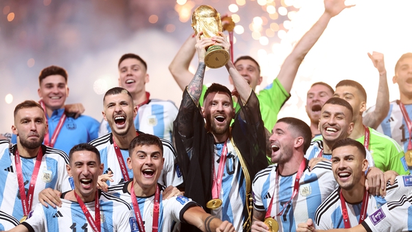 Argentina captain Lionel Messi lifts the World Cup trophy after one of the most dramatic World Cup finals in history