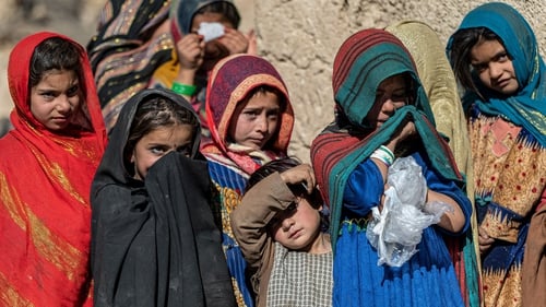 Afghan children pictured in front of their house in the Barmal district of Paktika province last week