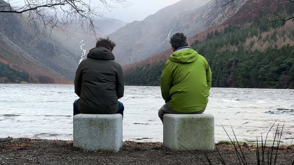 Artists Richard Healy and Frank Corry take in the view at the 'Suí' art project installation in Glendalough, Co Wicklow