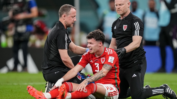 Wales' Neco Williams being treated during the 2022 World Cup