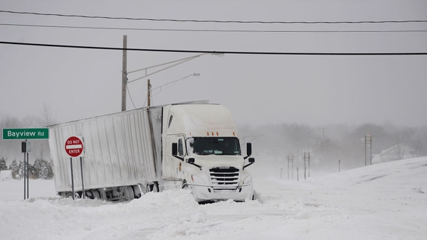 A truck remains stuck in snow along the Lake Erie shoreline, in Hamburg, New York
