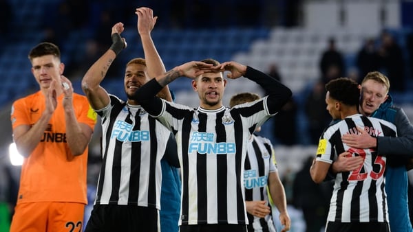 Newcastle United players salute the away end after their win at Leicester