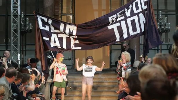Westwood on the runway in 2012 in a T-shirt saying 'climate revolution' (Yui Mok/PA)