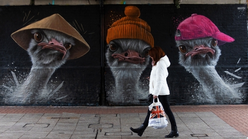 A shopper with a Union Jack flag walks in Southend