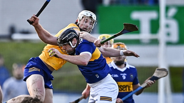 Enda Heffernan of Tipperary battles for possession with Clare's Brandon O'Connell