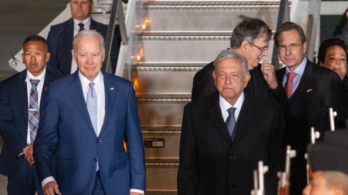 Mexican President Andres Manuel Lopez Obrador welcomes US President Joe Biden upon arrival in Mexico