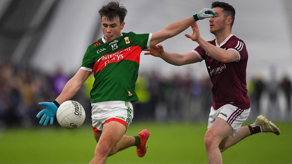 Mayo's Paul Towey gets a shot away despite the close attention of Ian Burke