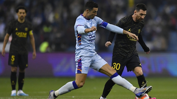 Ronaldo and Messi battle for possession
