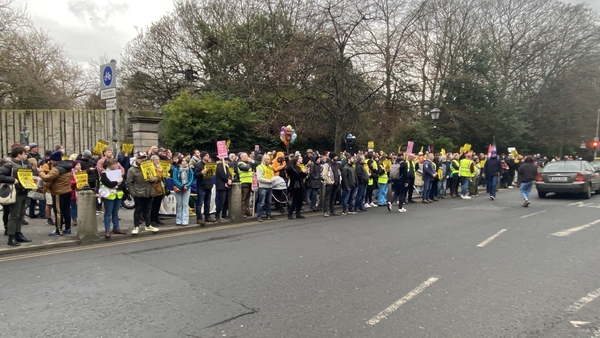 Around 200 people are taking part in a 'Refugees are welcome' protest across the road from the Shelbourne Hotel