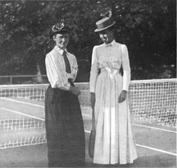 Black and white photo of two white women in Edwardian blouses and skirts