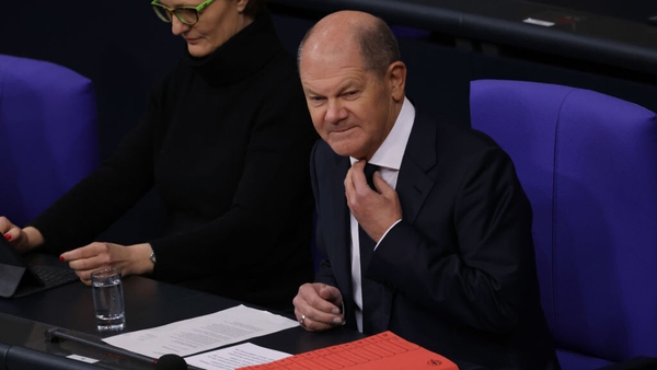 Olaf Scholz arrives to take questions from parliamentarians at a session of the Bundestag following the tank announcement