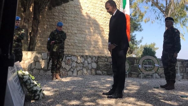 Micheál Martin, who is visiting Irish peacekeepers in Lebanon, lays a wreath to honour the Irish troops in the UN mission