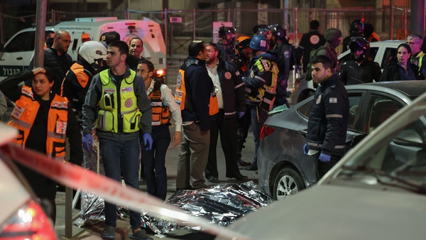 Israeli emergency service personnel and security forces at the scene of the attack