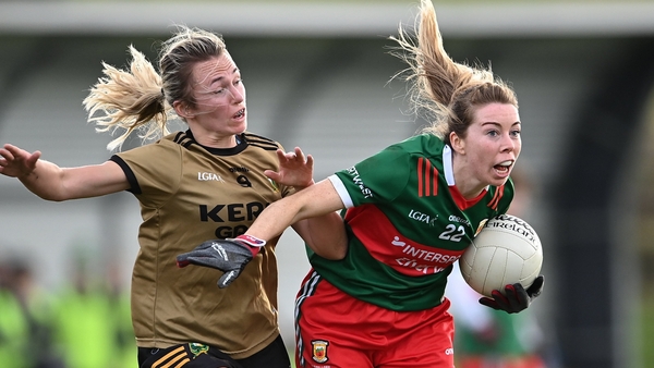Sarah Tierney of Mayo breaks clear from Niamh Carmody