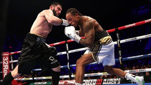Artur Beterbiev (L) and Anthony Yarde (R) exchange punches during their WBC, IBF and WBO light heavyweight championship fight