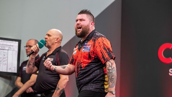 PDC world champion Michael Smith defeated another Smith to progress Credit: Taylor Lanning/PDC
