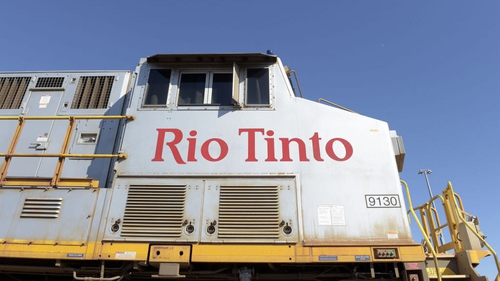 A Rio Tinto Group locomotive travels along a track at the company's rail yard in Karratha, Western Australia