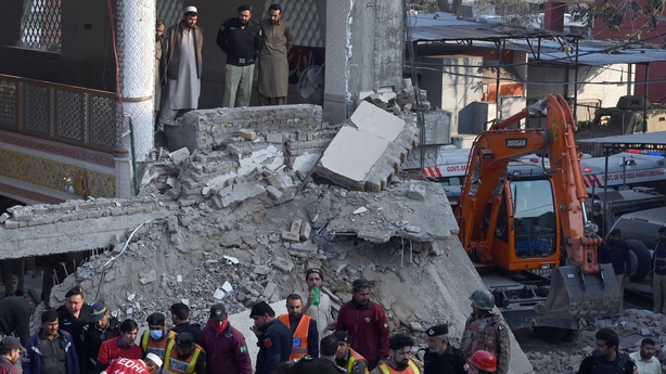 Heavy machinery is being used to clear the collapsed debris to find the survivors trapped under the rubble