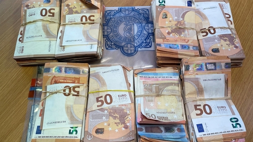 Woman held after €130,000 in cash seized