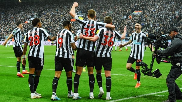 Sean Longstaff celebrates his second goal with his Newcastle United team-mates
