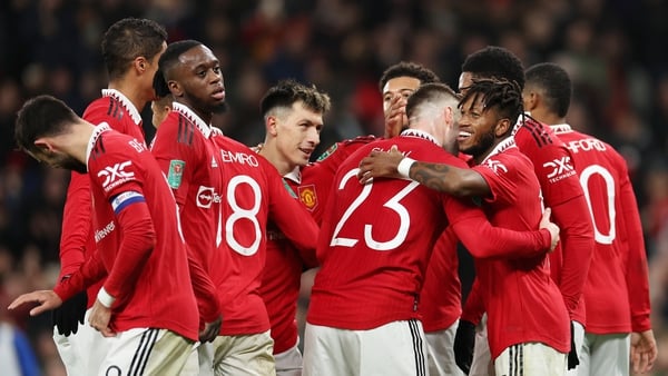 Fred celebrates with team-mates after scoring United's second