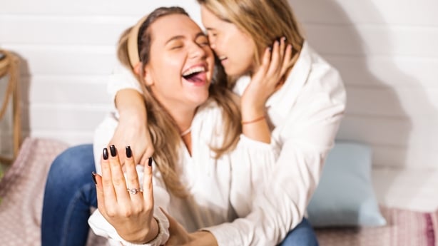 Gay couple marriage proposal concept, love is love, wedding ring, engagement