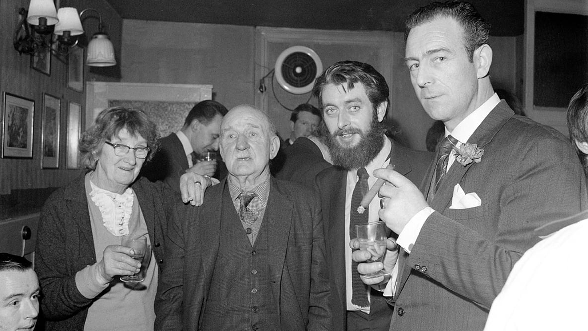 From left to right, Irish republicans Kathleen Behan and Stephen Behan with The Dubliners vocalist and guitarist Ronnie Drew and The Dubliner's manager John Sheridan.